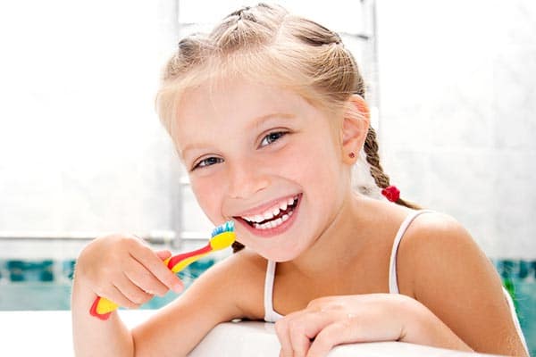 child brushing teeth