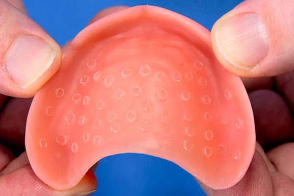 Suction cup dentures – a non-invasive denture process